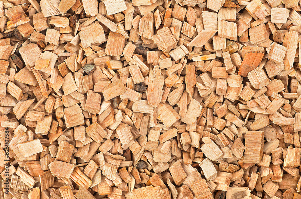 Wooden smoking chips as background, top view. Wood shavings for smoking meat and fish. Wooden smoking chips as background, top view. Wood shavings for smoking meat and fish.
