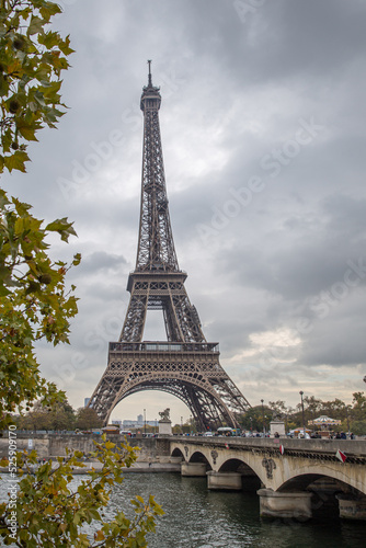 side view of the eiffel tower with the seine river beside it © Tatiana