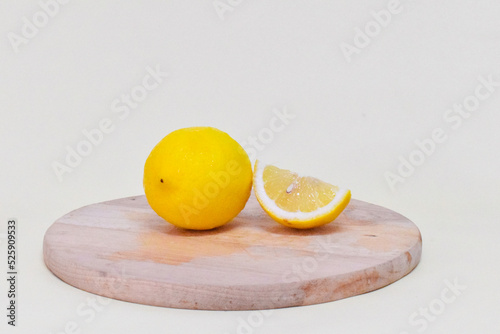 lemon on a wooden cutting board