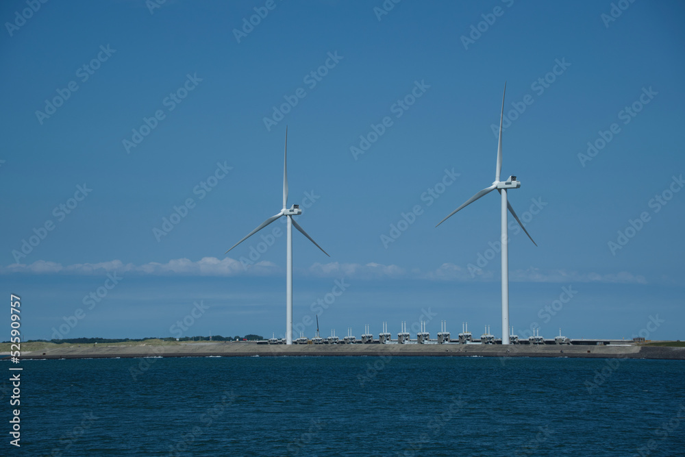 View of Neeltje Jans flood barrier with wind turbines View of Neeltje Jans flood barrier with wind turbines