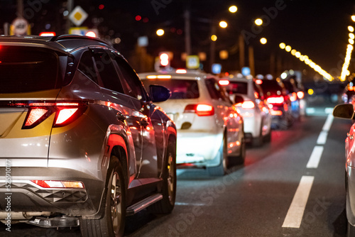 Background, blur, out of focus, bokeh. traffic jams, road repairs, or accidents. red brake lights of stopped cars.