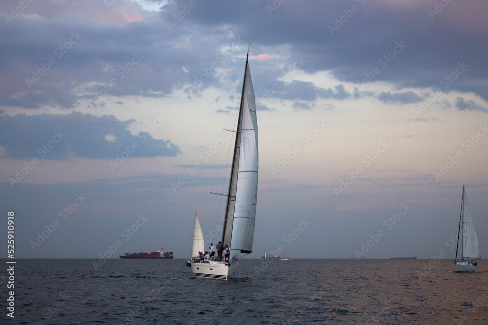 Sailing yacht regatta. Sailboats under sail in the race. Yachting. Luxury yachts.