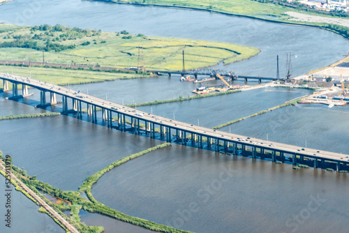Aerial view of the New Jersey Turnpike Bridge K303 and New Jersey transit rail bridge over the swamps of the Meadowlands in New Jersey.