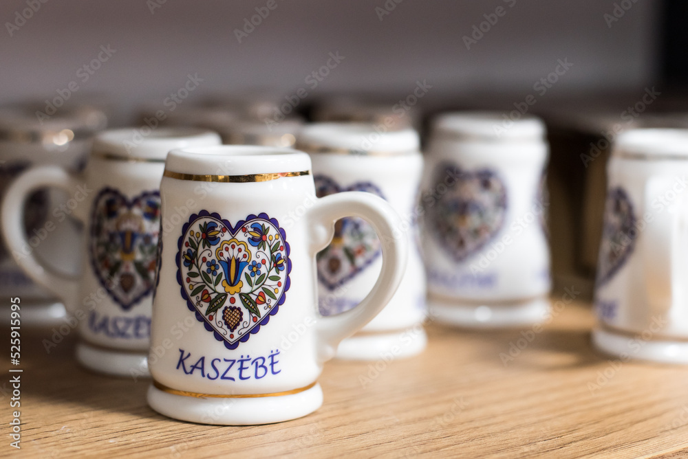 Small beer mugs with folklore symbols, a souvenir from Kashubia. - obrazy, fototapety, plakaty 