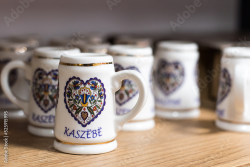 Small beer mugs with folklore symbols, a souvenir from Kashubia.