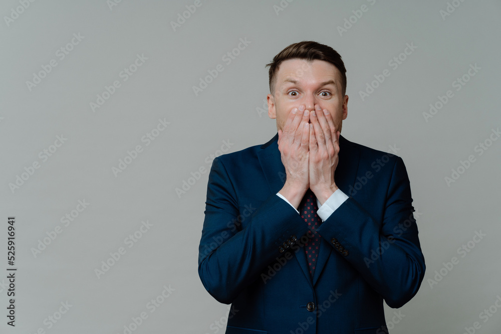 Shocked businessman feeling worried while receiving bad negative news