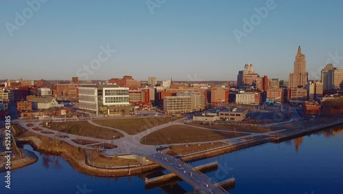 2021 - Excellent aerial shot of of architecture, a park, and a bridge spanning a river in Pawtucket, Rhode Island. photo