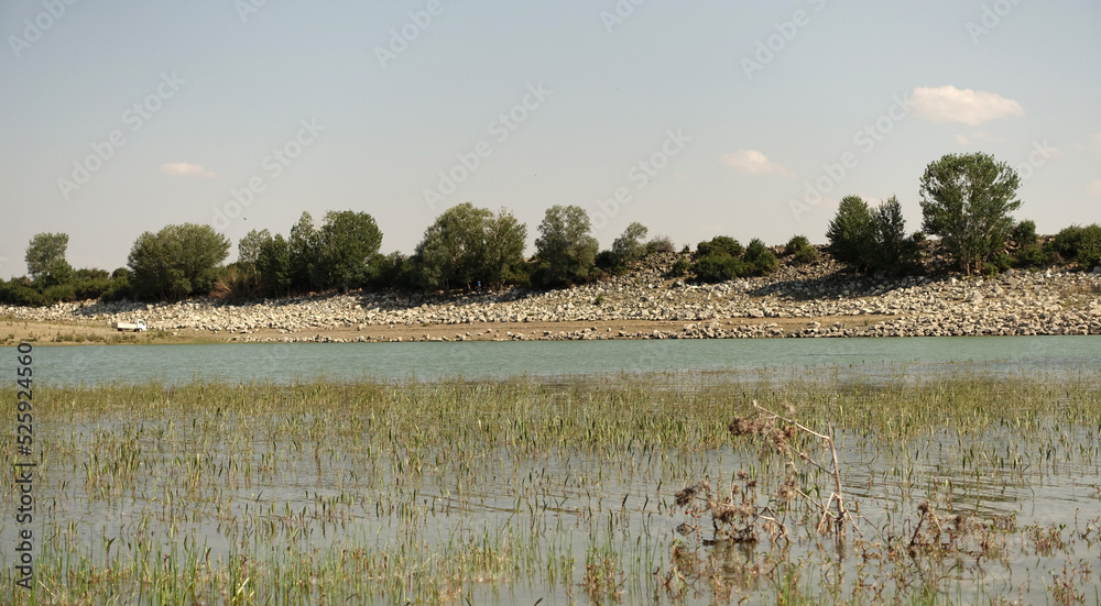 The irrigation dam of a village has lost a lot of water as a result of drought, the pond whose water has decreased, the tragic situation of the drought and irrigation pond,