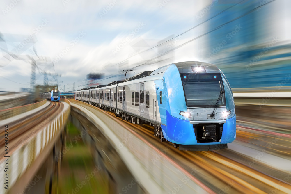 Fototapeta premium Two modern high speed train moves fast moving over the bridge overpass at the turn in the city block.
