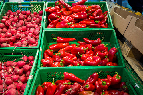 bell peppers on the counter, fresh vegetables for customers in the supermarket