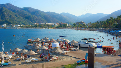 Fototapeta Naklejka Na Ścianę i Meble -  View of the beaches of Icmeler in the evening. Mountain peaks of Icmeler bay, Turkey.