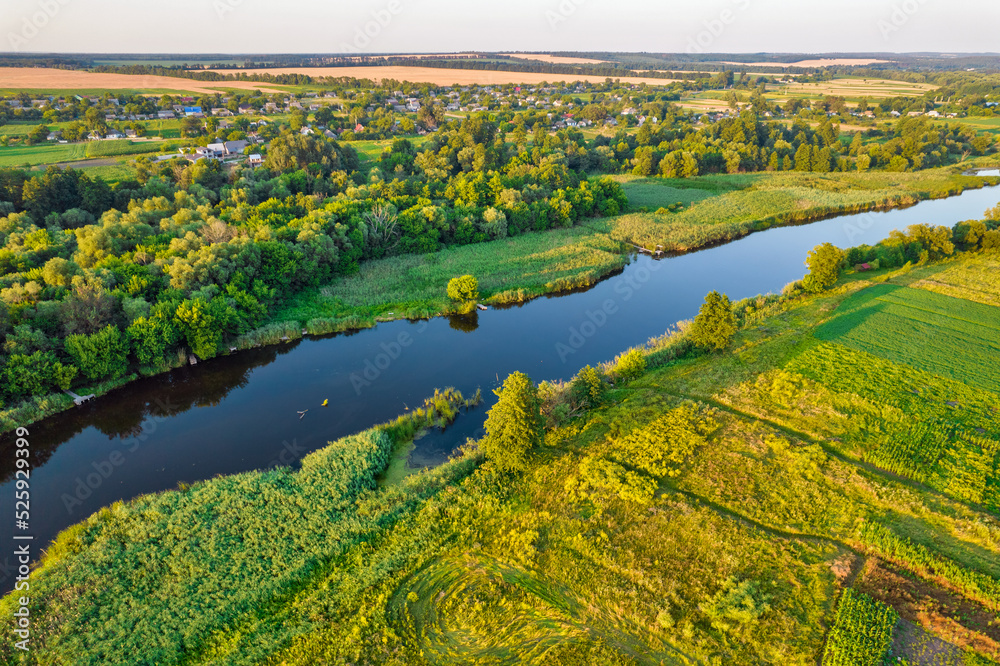 Drone view over summer sunset river Ros landscape, Ukraine.