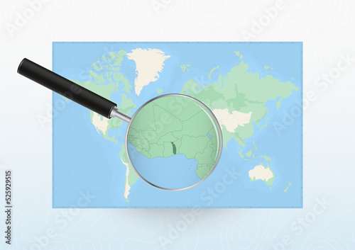 Map of the World with a magnifying glass aimed at Togo, searching Togo with loupe.