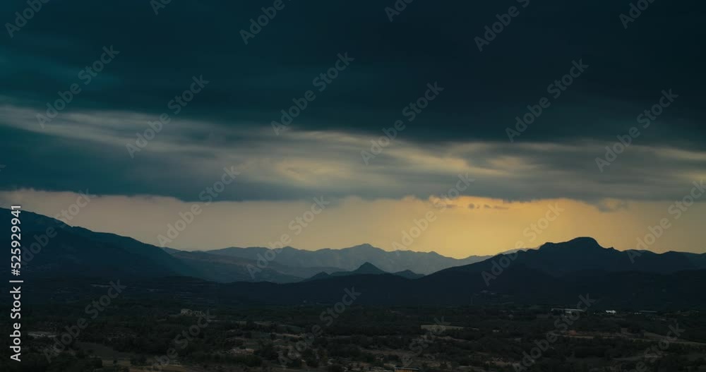 Dramatic sky at sunset on mountain beautiful landscape shot in timelapse. Hyperlapse of rainy clouds at evening. 