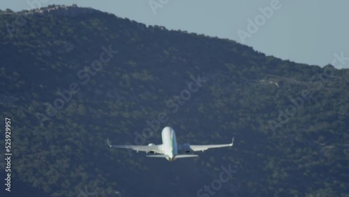 Wallpaper Mural The plane flies in the mountains. Slow motion video takes off in the mountains. High quality 4k footage Torontodigital.ca