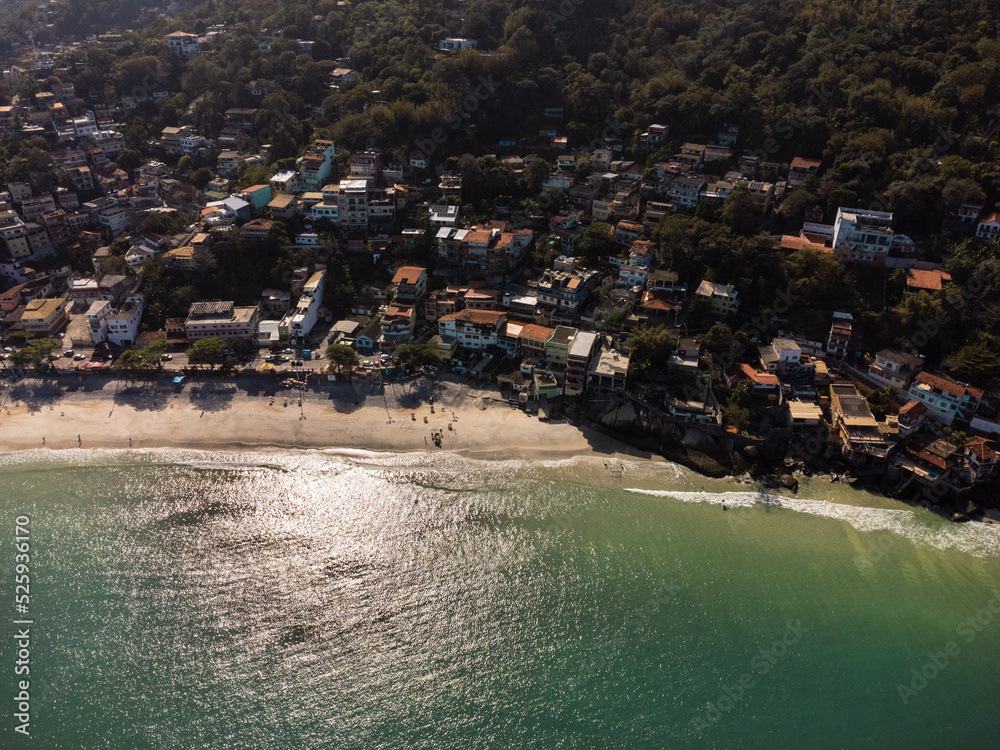Aerial view of Barra de Guaratiba, west zone of Rio de Janeiro, Brazil. Next to Marambaia beach. Big hills around. Sunny day at dawn. Beach with clear water. Barra de Guaratiba beach. Drone photo