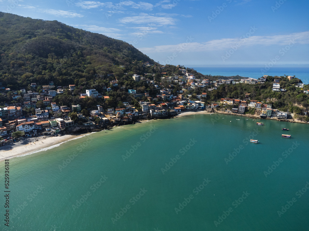 Aerial view of Barra de Guaratiba, west zone of Rio de Janeiro, Brazil. Next to Marambaia beach. Big hills around. Sunny day at dawn. Beach with clear water. Barra de Guaratiba beach. Drone photo