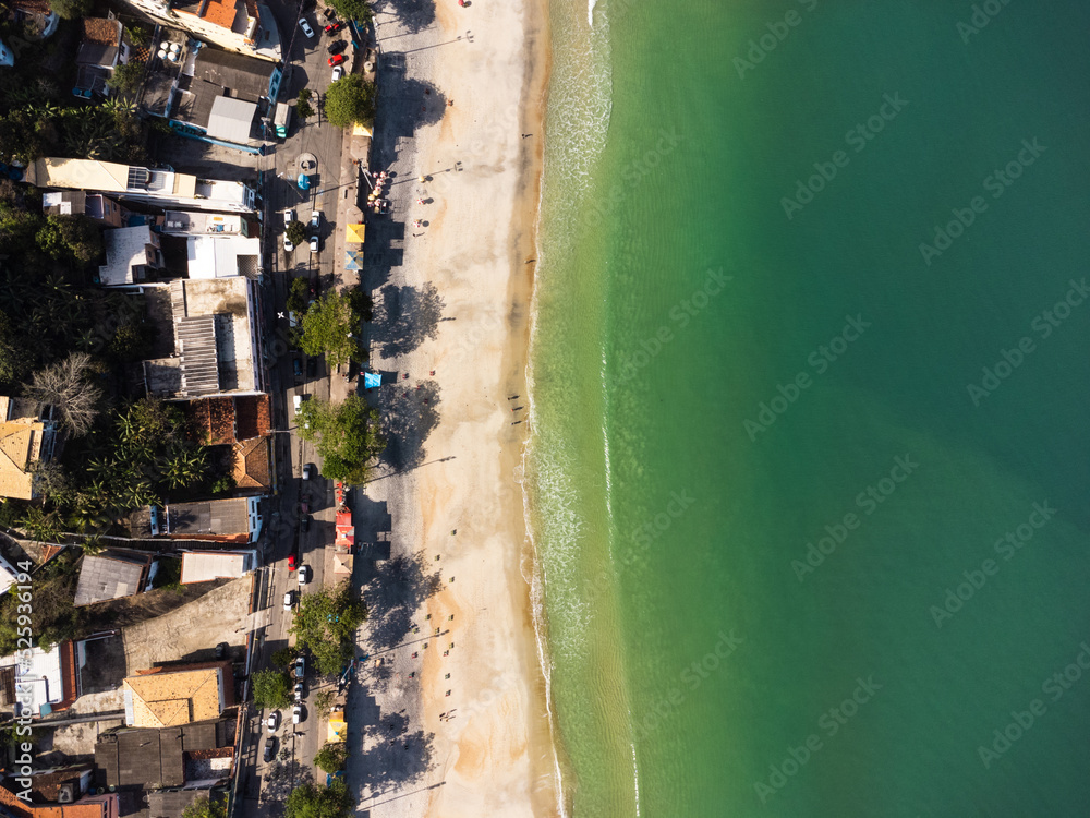 Aerial view of Barra de Guaratiba, west zone of Rio de Janeiro, Brazil. Next to Marambaia beach. Big hills around. Sunny day at dawn. Beach with clear water. Barra de Guaratiba beach. Drone photo