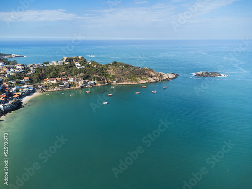 Aerial view of Barra de Guaratiba, west zone of Rio de Janeiro, Brazil. Next to Marambaia beach. Big hills around. Sunny day at dawn. Beach with clear water. Barra de Guaratiba beach. Drone photo © Diego