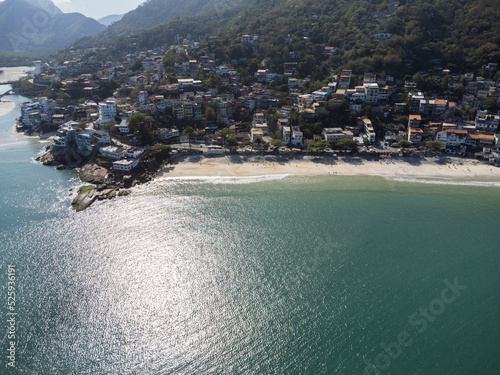 Aerial view of Barra de Guaratiba, west zone of Rio de Janeiro, Brazil. Next to Marambaia beach. Big hills around. Sunny day at dawn. Beach with clear water. Barra de Guaratiba beach. Drone photo photo