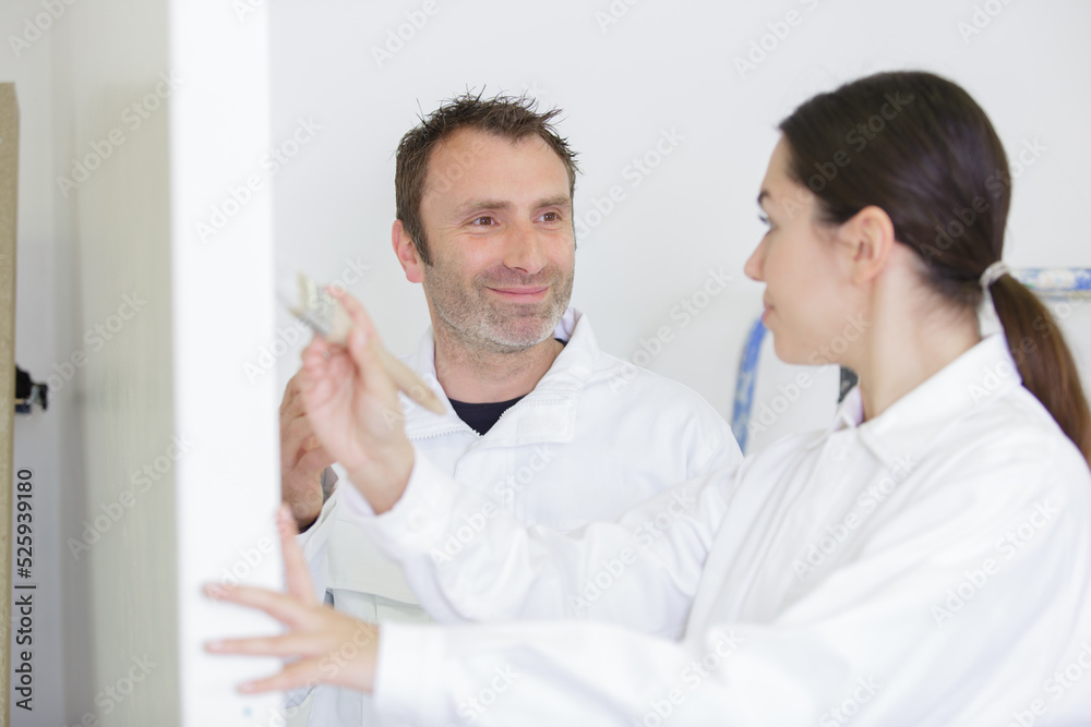 female and male painters happy to work on new project female and male painters happy to work on new project