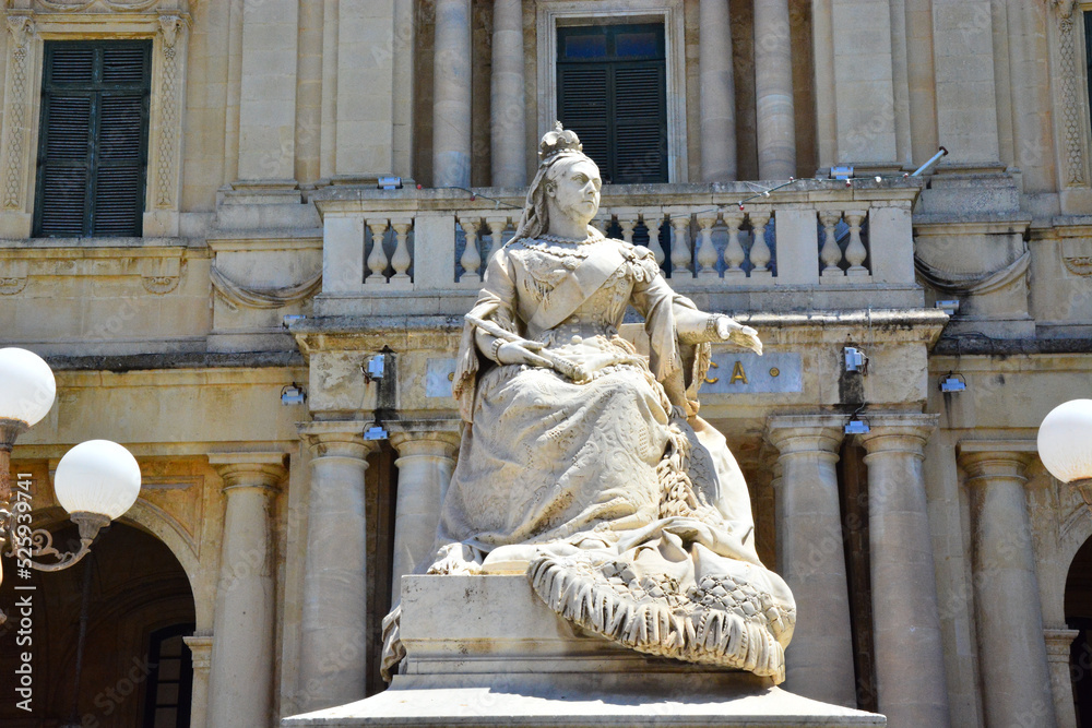 Statue of Queen Victoria in front of National Library, Bibliotheca, Republic Square, in Valletta,  capital city of Malta, 