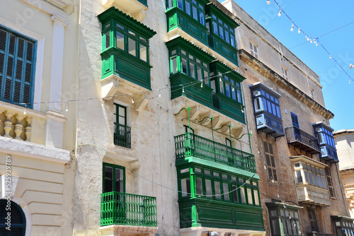 Street view of Valletta; traditional colorful balconies in the old city of Valletta, Maltese residential architecture, windows
