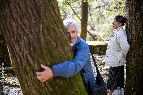 Senior Couple Enjoying the Energy Vibration of Trees © Fotopogledi