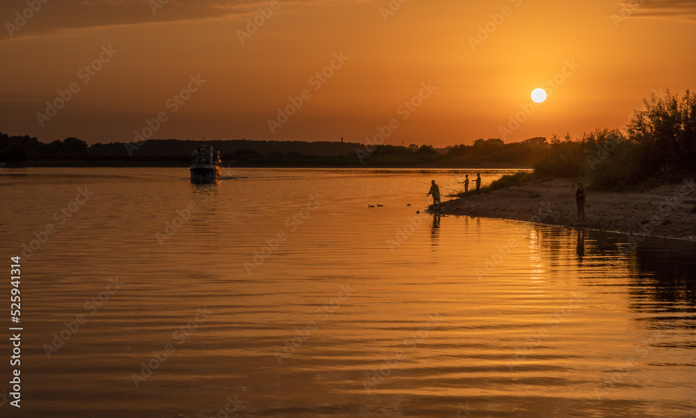 Beautiful bright dramatic sunset over the river