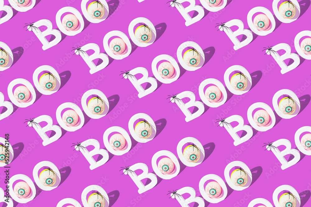 Creative spooky seamless pattern with word BOO on purple background. Trendy Halloween concept. Creative spooky seamless pattern with word BOO on purple background. Trendy Halloween concept.