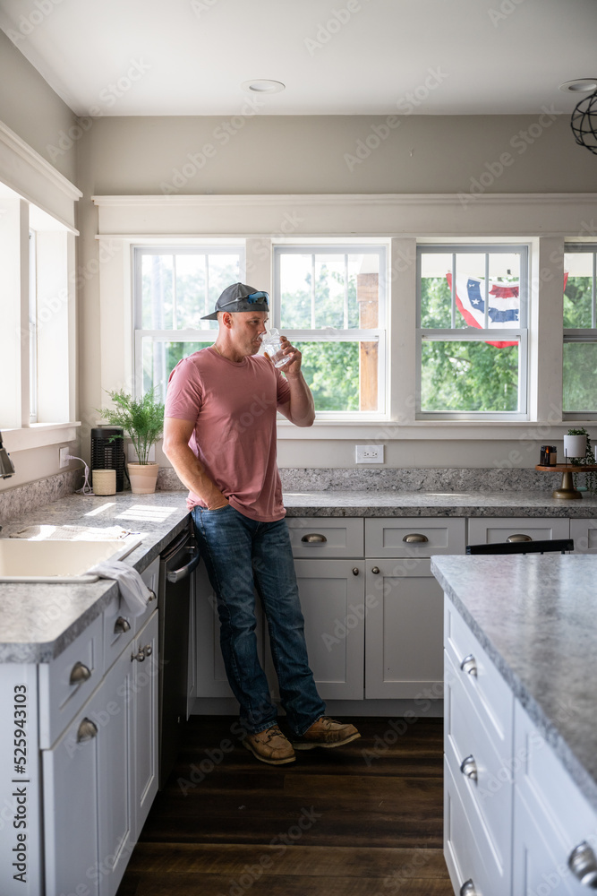 Marine veteran at home with family on a early morning in the kitchen. Marine veteran at home with family on a early morning in the kitchen.