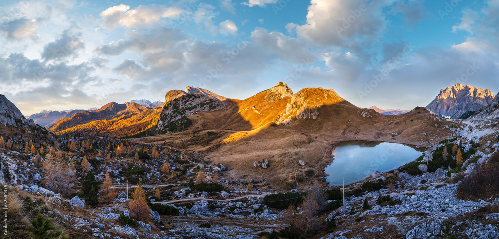 Naklejka premium Early morning autumn alpine Dolomites mountain scene. Peaceful Valparola Pass and Lake view, Belluno, Italy.