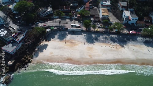 Aerial view of Barra de Guaratiba, west zone of Rio de Janeiro, Brazil. Next to Marambaia beach. Big hills around. Sunny day at dawn. Beach with clear water. Barra de Guaratiba beach. Drone take.
