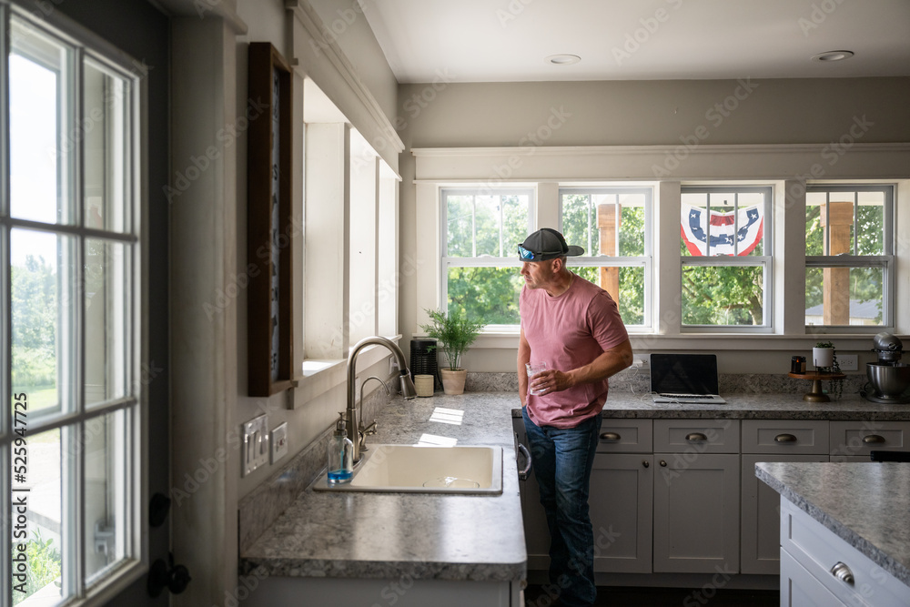 Marine veteran at home with family on a early morning in the kitchen. Marine veteran at home with family on a early morning in the kitchen.