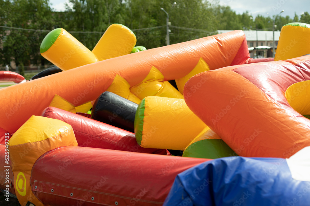 Foto Stock Deflate obstacle course in amusement park. Air escapes from  inflatable structure. Details of collection of attractions. | Adobe Stock