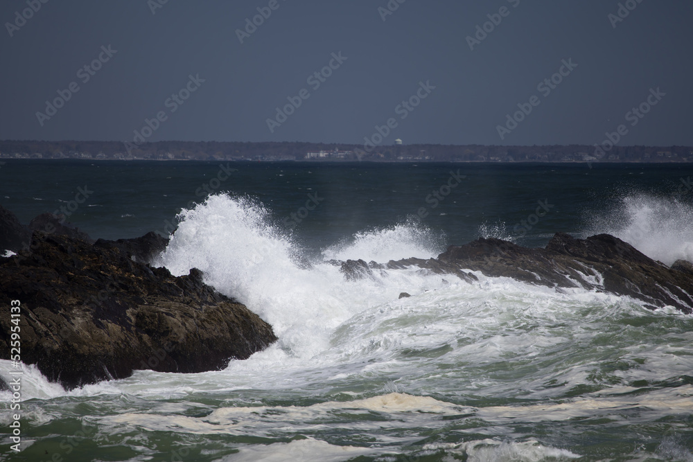 Ocean waves crashing against a rocky shore