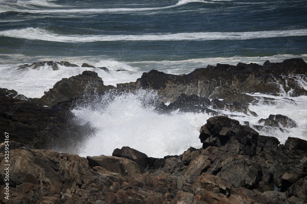 Ocean waves crashing against a rocky shore Ocean waves crashing against a rocky shore