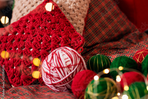 christmas decoration with balls of yarn on decorative background