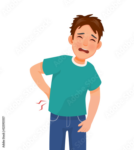 Handsome young man suffering from lower back pain 