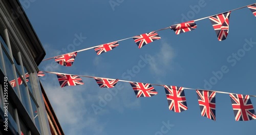 Union Jack flags flying from houses in the streets of England, Great Britain