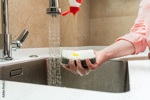 Dishwashing detergent dripping on the buzzer in hand