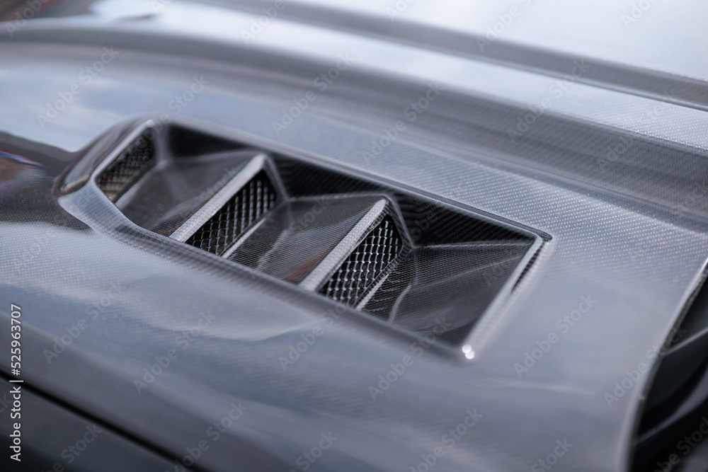 Luxury sports car fragment, aerodynamics carbon grille covers air intake system