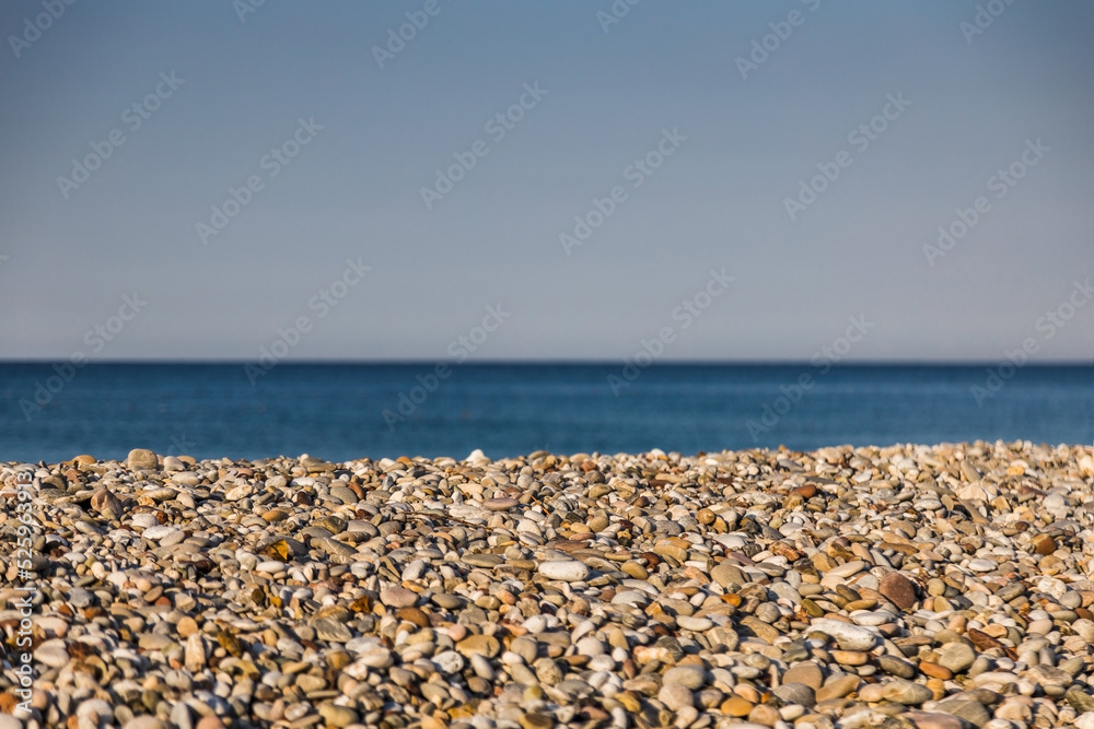Sea pebbles against the blurred the sea. Sea pebbles against the blurred the sea.