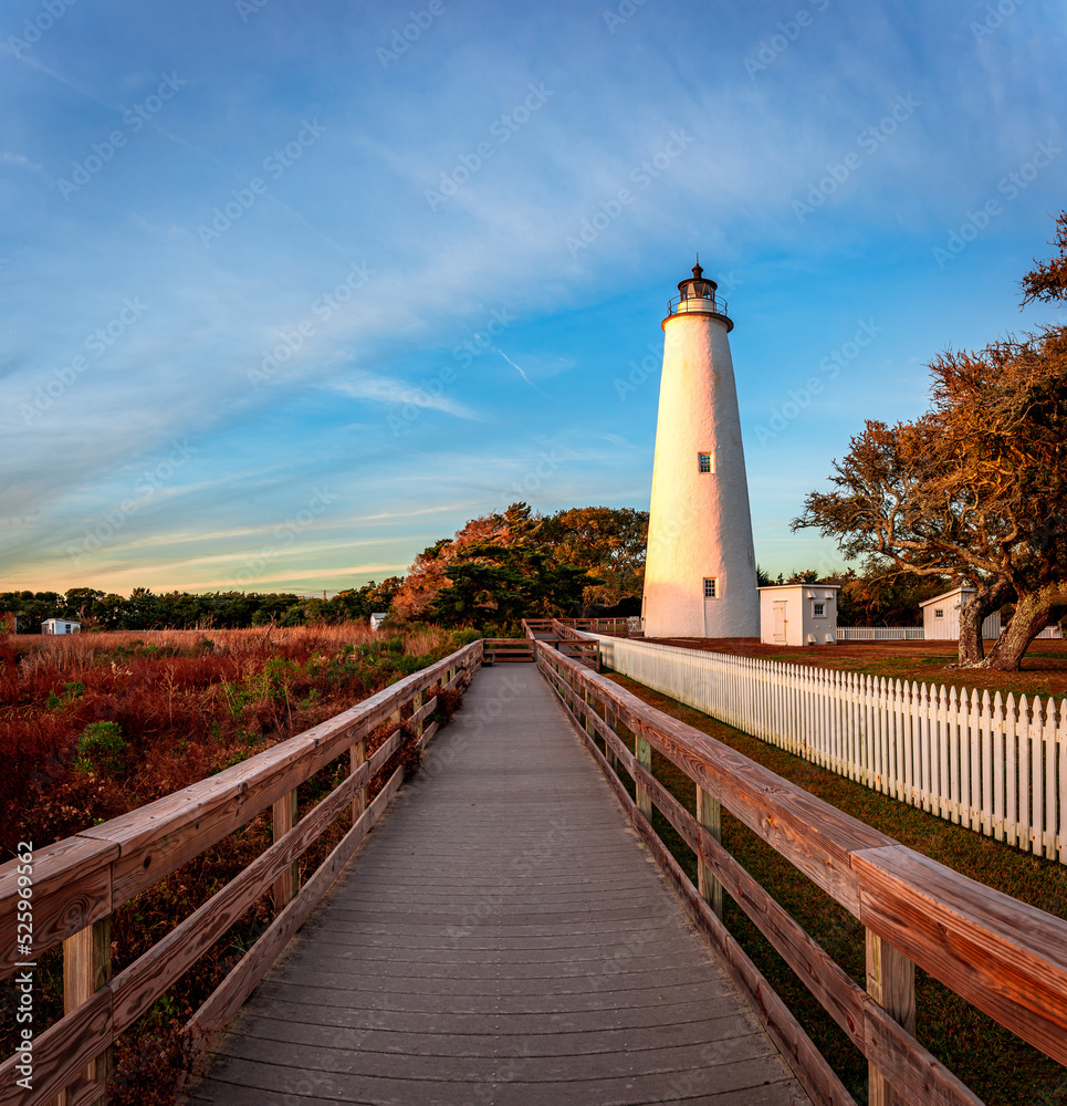 Ocracoke Lighthouse on Ocracoke , North Carolina at sunset.The lighthouse was built to help guide ships through Ocracoke Inlet into Pamlico Sound.