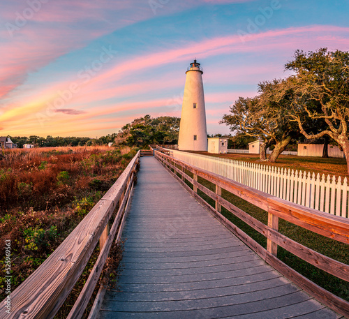 Ocracoke Lighthouse on Ocracoke , North Carolina at sunset.The lighthouse was built to help guide ships through Ocracoke Inlet into Pamlico Sound. photo