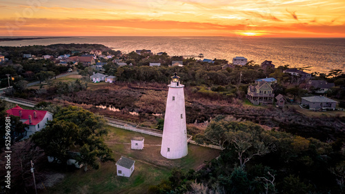 Ocracoke Lighthouse on Ocracoke , North Carolina at sunset.The lighthouse was built to help guide ships through Ocracoke Inlet into Pamlico Sound.