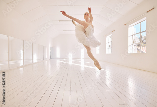 Ballet dance, jump and studio dancer dancing beautiful, elegant or classic performance in theater room. Stage artist, professional theatre ballerina and creative woman with energy moving with beauty