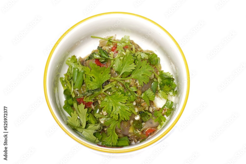 Young chili paste in a white casserole garnished with coriander leaves Young chili paste in a white casserole garnished with coriander leaves