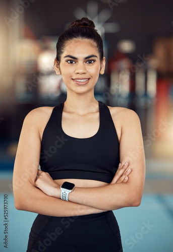 Happy training woman in gym, wellness athlete and exercise fitness. Healthy motivation portrait, sportswear equipment and slim person standing proudly and confident after cardio workout