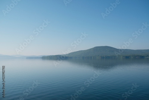 The landscape of a beautiful blue lake in summer on a sunny day